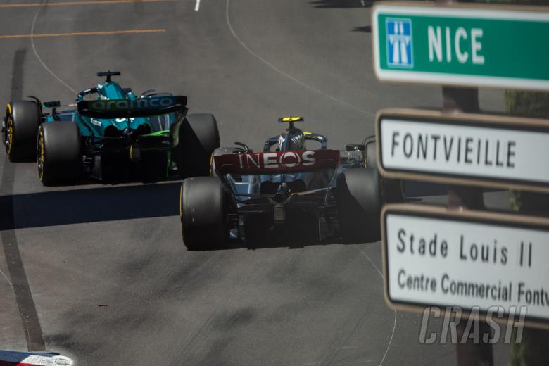 Lance Stroll (CDN) Aston Martin F1 Team AMR23 leads Lewis Hamilton (GBR) Mercedes AMG F1 W14. Formula 1 World